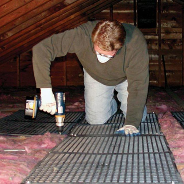 Attik Dek attic flooring being installed in attic