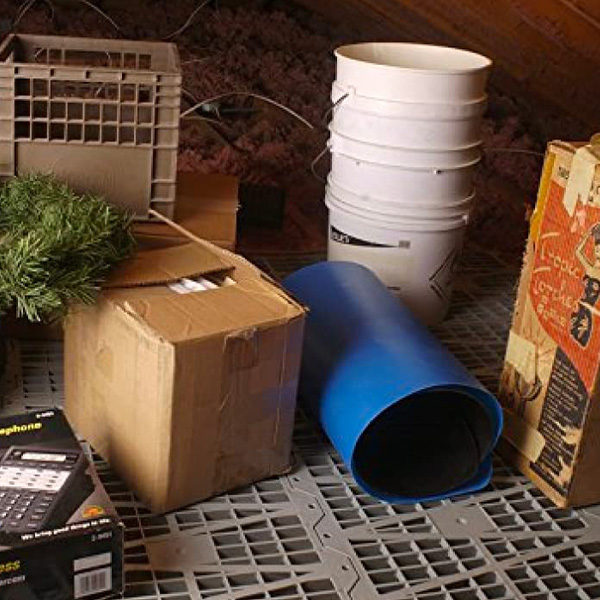 Attik Dek attic flooring in use with organized storage items in an attic